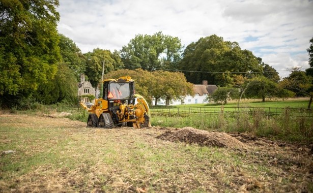 Large mole plough in front of South Wiltshire landscape.